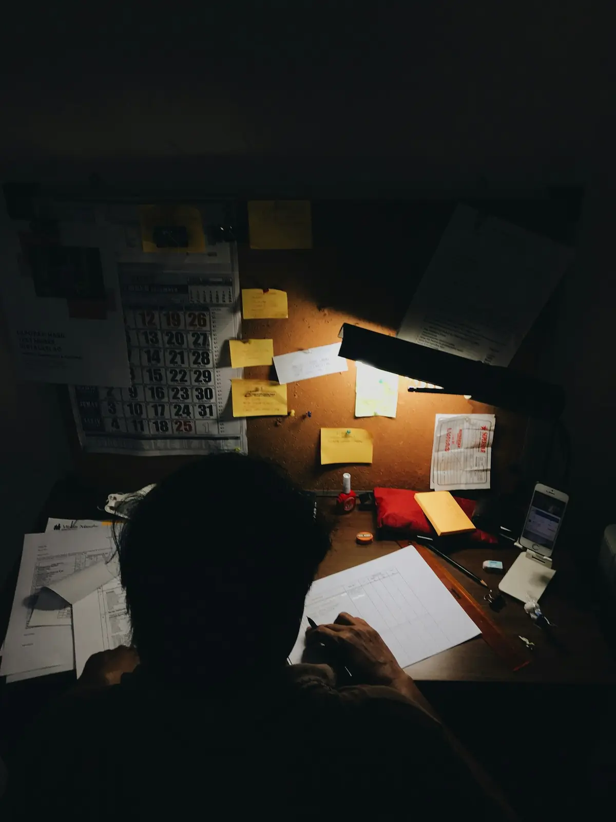 Organizing policy paperwork at a desk