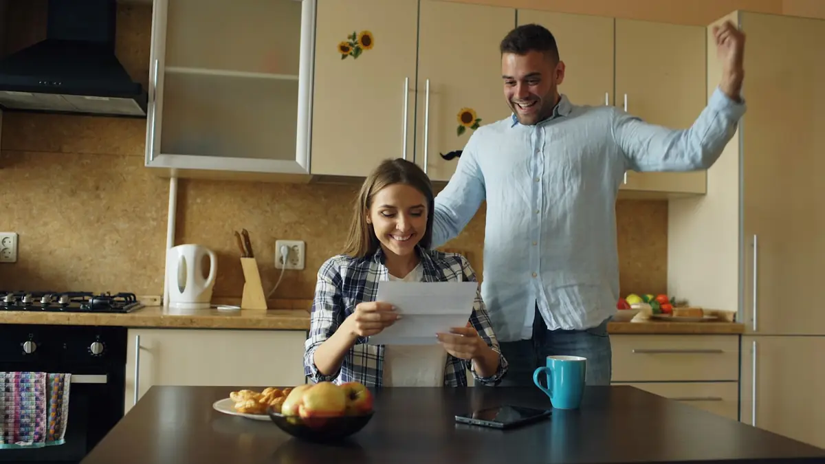 Couple weighing life insurance options at home